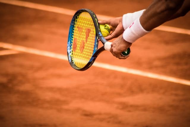 Why Tennis Players Blow On Their Hands (Explained)